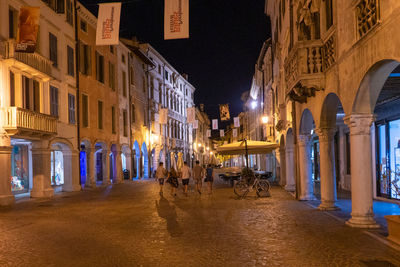 Illuminated buildings in city at night