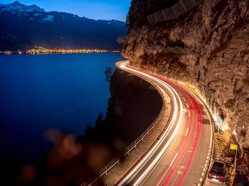 High angle view of light trails on road at night