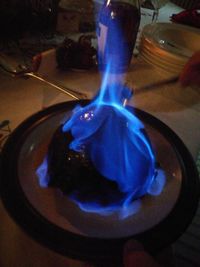 Close-up of blue pouring in plate