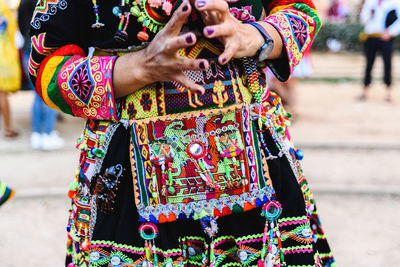 People with multi colored umbrellas