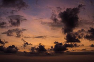 Low angle view of cloudy sky at sunset