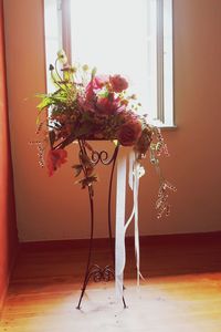 Flower vase on table at home