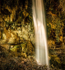 Scenic view of waterfall in forest