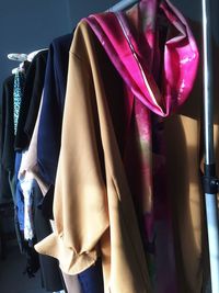 Close-up of clothes hanging on rack in store