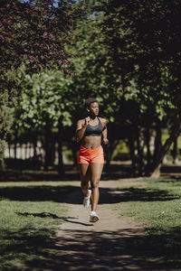 Full length of woman running in park