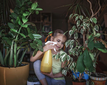 Woman holding potted plant