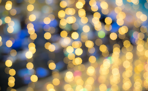 Defocused image of illuminated lights at night