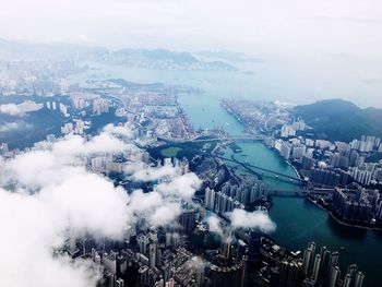 High angle view of buildings in city against sky