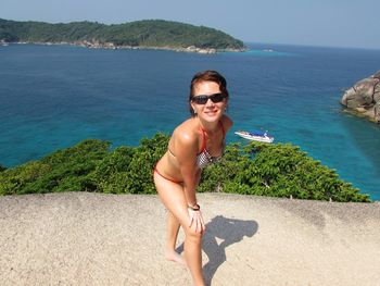 Portrait of smiling young woman on beach