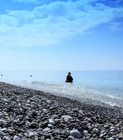 Scenic view of sea against cloudy sky