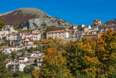 View of townscape against blue sky