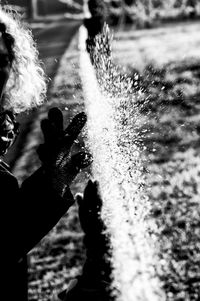 Man holding water splashing