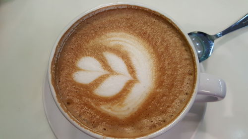 High angle view of cappuccino on table