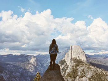 Rear view of man standing on mountain