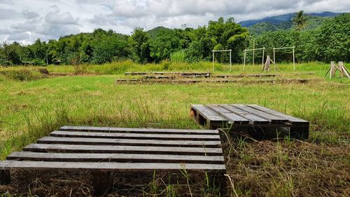Built structure on field against sky
