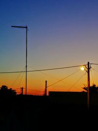 Silhouette bridge against sky during sunset