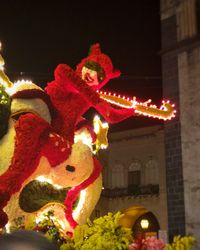 Low angle view of illuminated christmas tree at night