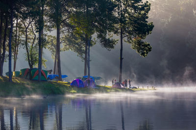 Woman camping by lake