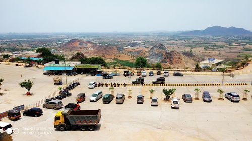 High angle view of cars on road against sky