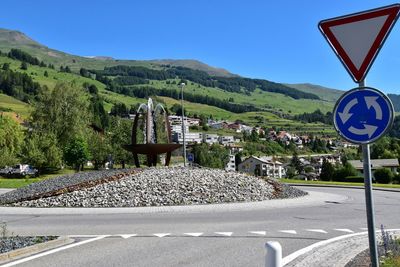 Road sign against clear sky