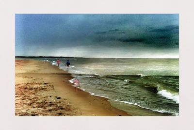 Scenic view of sea against cloudy sky