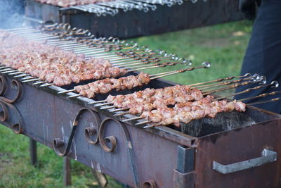 Close-up of kebabs in skewers on barbecue grill