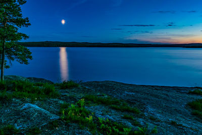 Scenic view of sea against sky at dusk