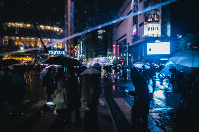 People on street at night