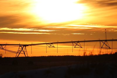 Silhouette landscape against sky during sunset