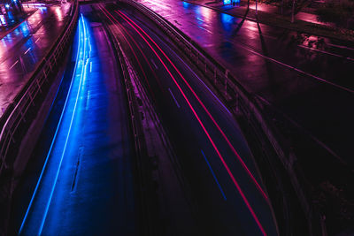 Light trails on illuminated city at night