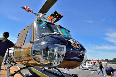 Low angle view of helicopter against sky