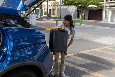 Rear view of woman walking on street
