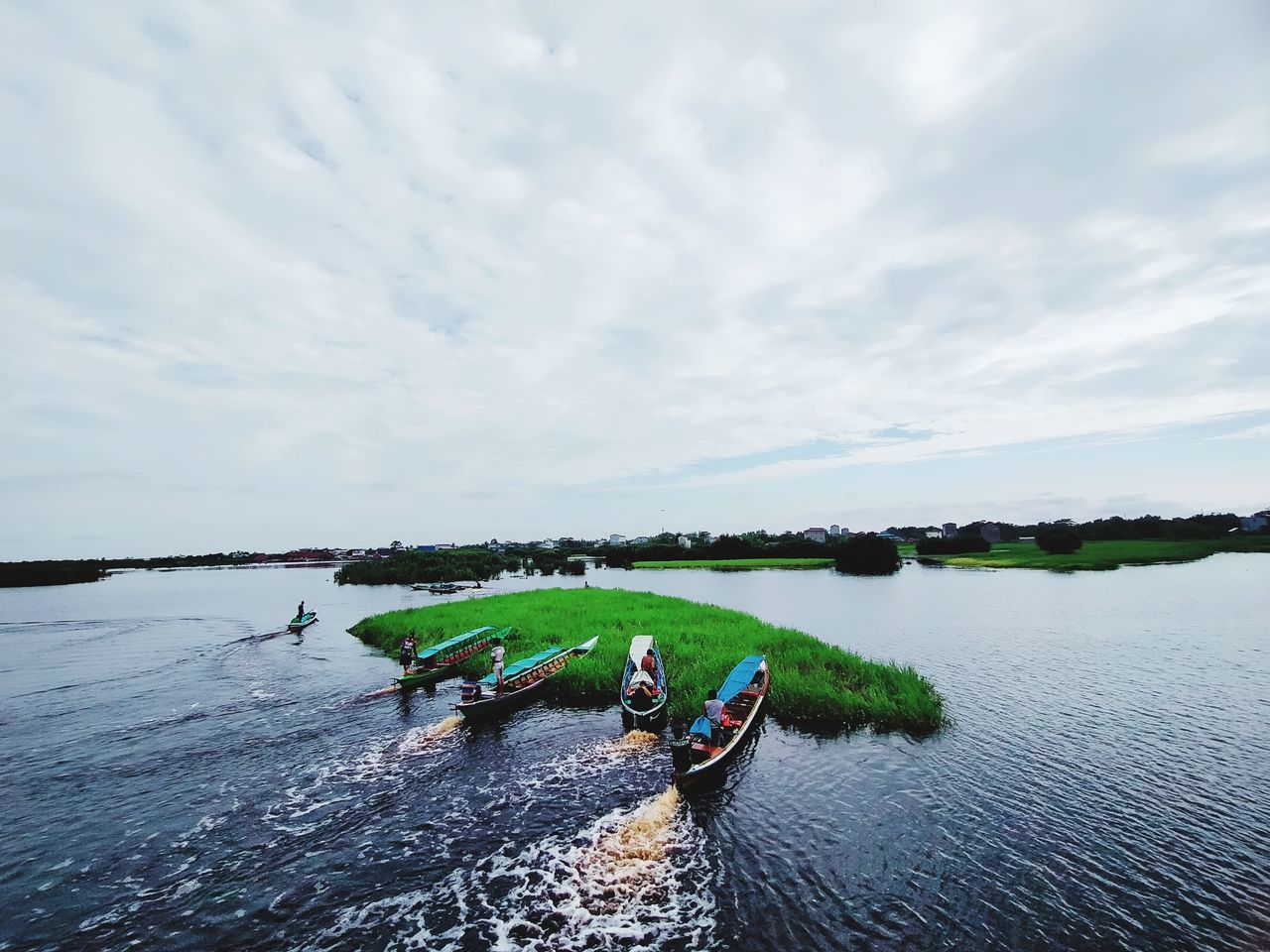 water, boating, sky, nature, cloud, nautical vessel, vehicle, sea, transportation, boat, day, men, adult, paddle, sports, outdoors, group of people, beauty in nature, scenics - nature, teamwork, shore, adventure, cooperation, travel, leisure activity, watercraft, togetherness, oar, copy space, tranquility, motion, holiday, person, rowing, kayak, mode of transportation, lifestyles, trip, vacation