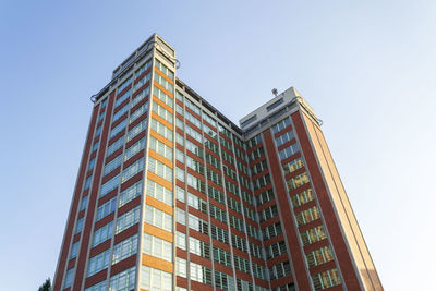 Low angle view of skyscraper against clear sky
