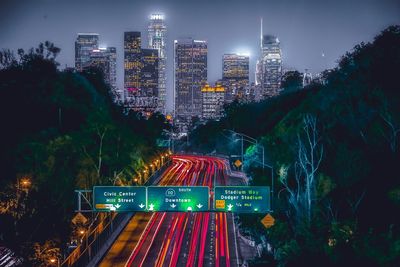 Aerial view of city lit up at night