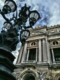 Low angle view of statue against sky in city