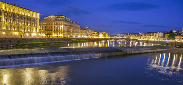 Illuminated buildings at waterfront