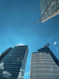 Low angle view of modern buildings against sky