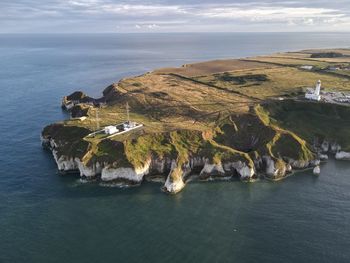 High angle view of sea shore against sky