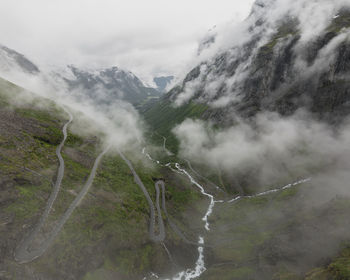 Scenic view of waterfall against sky