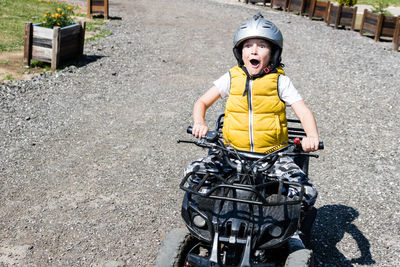 Portrait of boy riding motorcycle