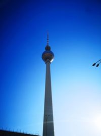 Low angle view of communications tower against sky