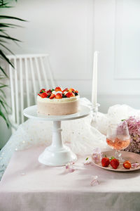 Cake and wine on table during celebration