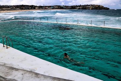 High angle view of people at swimming pool