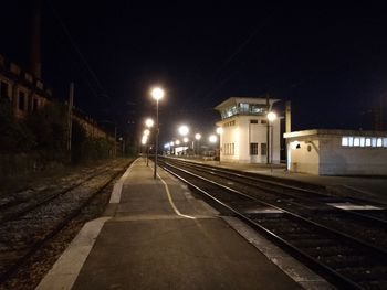 View of railroad station platform at night
