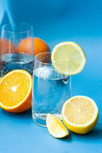 Lemon slice in glass on table