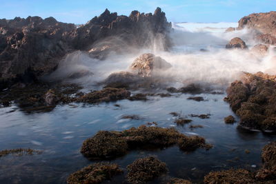 Scenic view of water streaming through rocks