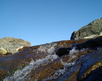 Scenic view of mountain against clear blue sky