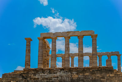 Low angle view of historical building against blue sky