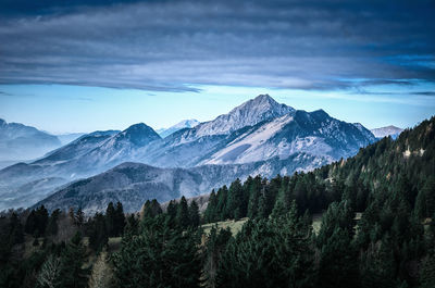 Scenic view of snowcapped mountains against sky at night